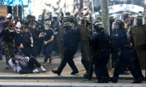 French CRS riot police charge amid clashes with protesters during a demonstration by high school and university students, supported by teachers' union and school parents, in Paris as part of a nationwide day of demonstrations and blockades, voicing anger over overcrowded classrooms, teacher shortages and dilapidated school buildings, which students blame on years of underinvestment, France, October 6, 2026. REUTERS/Yves Herman