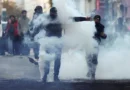Demonstrators react amid tear gas, the day after a national day of demonstrations against the cost of living and rising fuel prices, in Paris, France, October 18, 2026. REUTERS/Abdul Saboor